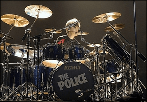Copeland behind a drum kit