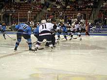 South Carolina Stingrays and Charlotte Checkers battle for control of the puck at a center ice face off; Charlotte Checkers at South Carolina Stingrays, April 17, 2009.
