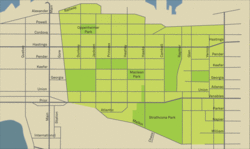 A map of the neighbourhood, highlighted light green, with streets and parks indicated
