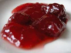 The image is of red strawberry jelly.