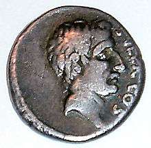 Photograph of a Roman coin that depicts a man with an aquiline nose.
