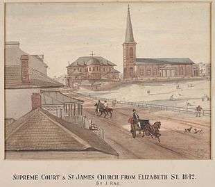 Watercolour of St James' next to the Supreme court. The view is looking north along an unpaved road (now Elizabeth Street) on which there are people walking, riding horses and driving carriages. An empty space (now Hyde Park) appears on the right hand side.