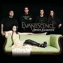 A picture showing five people in a black room. The woman in front has black hair and a yellow dress and is lying on a couch. Four men are shown behind her and all of them are wearing black T-shirts. In front of them, the word "Evanescence" is written with yellow letters. Another word "Sweet Sacrifice" can be also seen which is written with white letters.