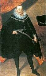 Bearded nobleman in black cape with high, white collar