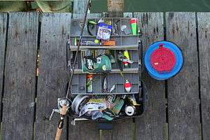 Typical tackle box with rod and bait bucket.