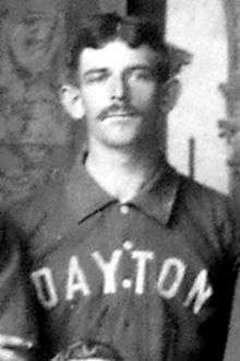 A man wearing baseball jersey with "Dayton" written on the front.