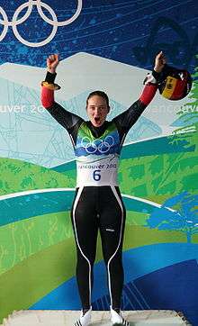 Athlete celebrating victory in event.