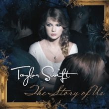 An image of a woman standing alone in a dark crowded room. She is wearing a white shirt and is looking aside. She is hugging herself while the light hits her upper body. Below her the words "Taylor Swift" and "The Story of Us" are written in white and gold colors respectively.