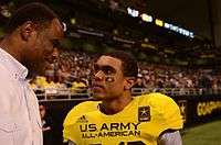 David Robinson, retired from the Spurs, speaks with his son, Corey Robinson, wide receiver for the West team, at the U.S. Army All-American Bowl at the Alamodome in San Antonio on Jan. 5, 2013.