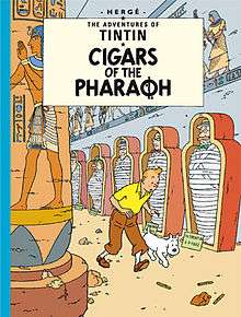 Tintin and Snowy are following a trail within an Egyptian tomb.