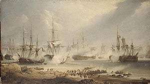 Seven ships lie in various states of repair on still waters. On the shore in the foreground large crowds rush towards the sea. Smoke drifts through the scene.