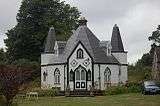 A large 18th century Gothic-revival birdhouse.