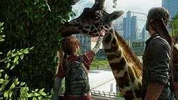 A teenage girl pets a giraffe, who is eating leaves from vegetation, as an older man watches from the side.