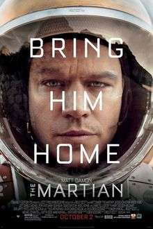 The tired and worn face of a man wearing a space suit, with the words "Bring Him Home" overlaid in white lettering. In smaller lettering the name "Matt Damon" and the title "The Martian