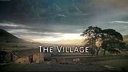 Series title over a view of the village