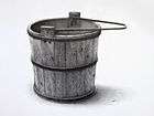 highly detailed drawing of wooden water bucket with black barrel hoops and handle, against white background