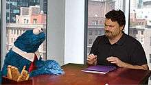 Double Fine Productions owner Tim Schafer and the character Cookie Monster during a promotional video for Sesame Street: Once Upon a Monster