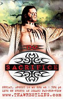 A poster with a white, black, and red logo with the word "Sacrifice" in red print across the center. A white adult male wearing a gold robe posing with the word "Pain" written across his chest while birds fly in the background is also featured.
