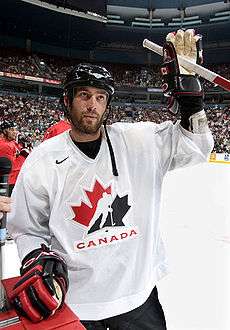 Todd Bertuzzi on the ice, waving to the crowd as a Team Canada team member.