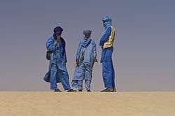 Group of Tuareg people in desert