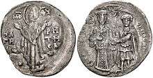 Obverse and reverse of a silver coin; the former with a standing image of the Virgin Mary, the latter with two standing figures, the left one dressed in regalia and the right one as a warrior saint, handing a castle to the former