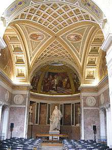 A room with a domed roof supported by round arches. The room beyond the facing arch has frescoes on the wall and a white marble statue of Galileo, also facing the viewer.