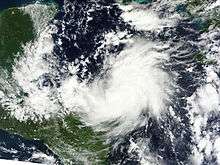 Satellite image of a tropical cyclone with banding features but no eye.