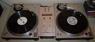 Two vinyl turntables and a small mixer