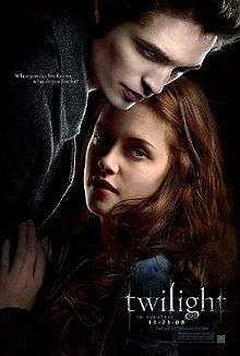 A pale young man fills the top left of the poster, standing over a brown-haired young woman on the right, with the word "twilight" on the lower right.