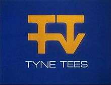 An arrangement of the letters TTTV in yellow on a blue background.