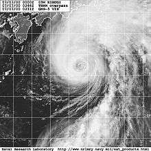 Satellite image of a weakening typhoon south of Japan. The storm's eye is mostly cloud-filled and cloud cover is mostly extending to the north of the center.