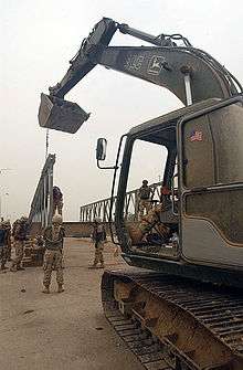 U.S. Navy Seabees attached to Naval Mobile Construction Battalion 133 rebuild Sarabadi Bridge