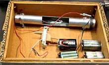 A bomb with wires in a wooden box