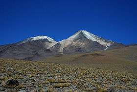 Uturunku is a cone in a desolate landscape, with an adjacent smaller non-conical mountain.