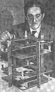 newspaper photograph of V. R. Parton demonstrating 3D chess