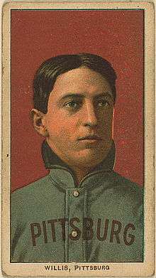 A color baseball card; pictured is a man in a heavy Pittsburgh uniform with his collar turned up