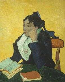 A well-dressed woman sits facing to her right (the viewer's left). She has two books on her lap, and is dressed in dark clothes vividly contrasted against a yellow background.
