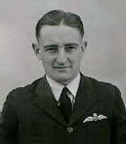 Head-and-shoulders portrait of man in dark uniform with pilot's wings