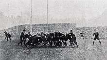 A mass of players compete for the ball in a scrum.