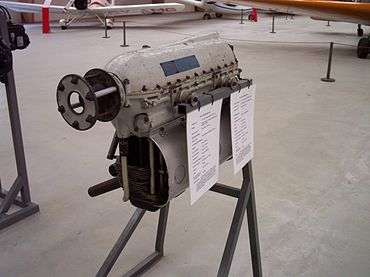 A font quarter view of an engine in a display stand