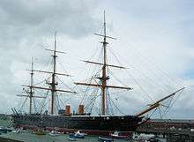 A picture of the iron-clad HMS Warrior docked in Portsmouth's historic harbour. The ship has since been restored to its original Victorian condition.