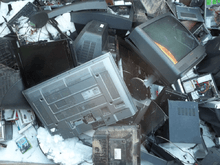 Waste electrical items accumulate at a dump.