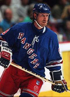 Hockey player in blue Rangers uniform