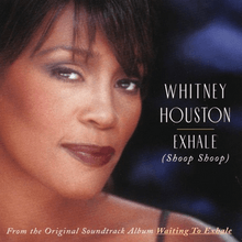 The face of a woman smiling. She has a brunette hair and is wearing dark-colored lip color. To the right of the image, the words "Whitney Houston" are printed, below which are the words "Exhale" and "Shoop Shoop." To the bottom of the image, "From the original soundtrack album Waiting to Exhale" is printed.