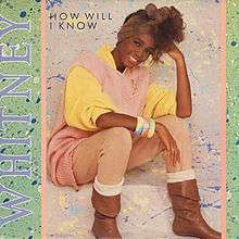A woman is sitting, with a smile on her face. She is looking forward and her head is resting on her left arm. She is wearing bangles on her right wrist. Next to her the word "Whitney" is written in medium purple capital letters. The words "How Will I Know" are written near her head.