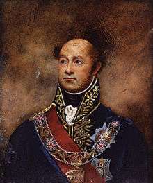 Painting shows a bald man in a high-collared dark blue military uniform with much gold braid. He wears a red sash and a number of decorations.