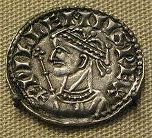 Coin image of a crowned male head with a sceptre in the background