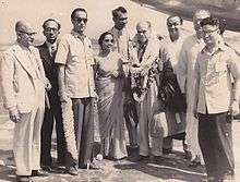 Diptendu Pramanick with Frank Capra, latter deluged with garlands at the Dum Dum airport, Calcutta in 1952