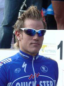 Wouter Weylandt wearing a Quick Step uniform and sunglasses.
