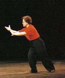 Wu Yanxia in the posture Grasp Bird's Tail during a form demonstration in Toronto, 1995